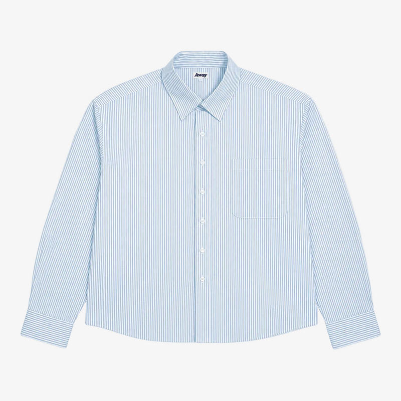 A light blue and white vertically striped long-sleeve button-up shirt with a single chest pocket, laid flat against a light gray background.
